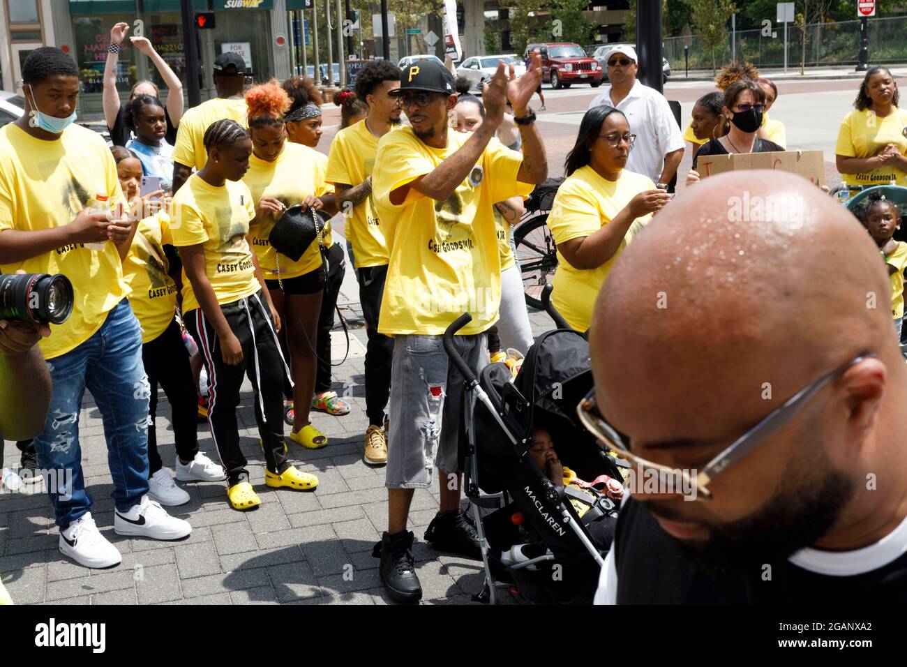 Family and friends of Casey Goodson Jr. rejoice after the benedictine prayer at the end of the march and rally.Friends and family of Casey Goodson Jr. were joined by Black Lives Matter activists outside of the Franklin County Common Pleas Courthouse for a march and rally to indict former Sheriff Deputy Jason Meade, who shot and killed Casey Goodson Jr. in December of 2020. This rally fell on the birthday of Tamala Payne, the mother of Casey Goodson Jr., and featured prayers from local pastors, a word from family attorney Sean Walton, words from Payne and a brief reflection on Goodson Jr.'s cha Stock Photo