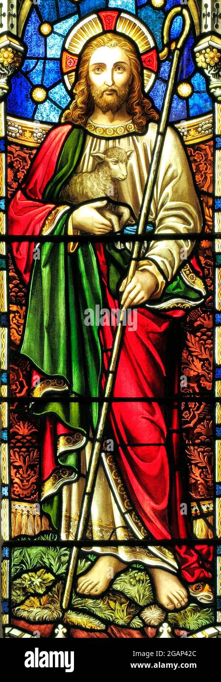 The Good Shepherd, with lamb and crook, stained glass window,  by E.. R. Suffling, late 19th century,  Fakenham, Norfolk Stock Photo