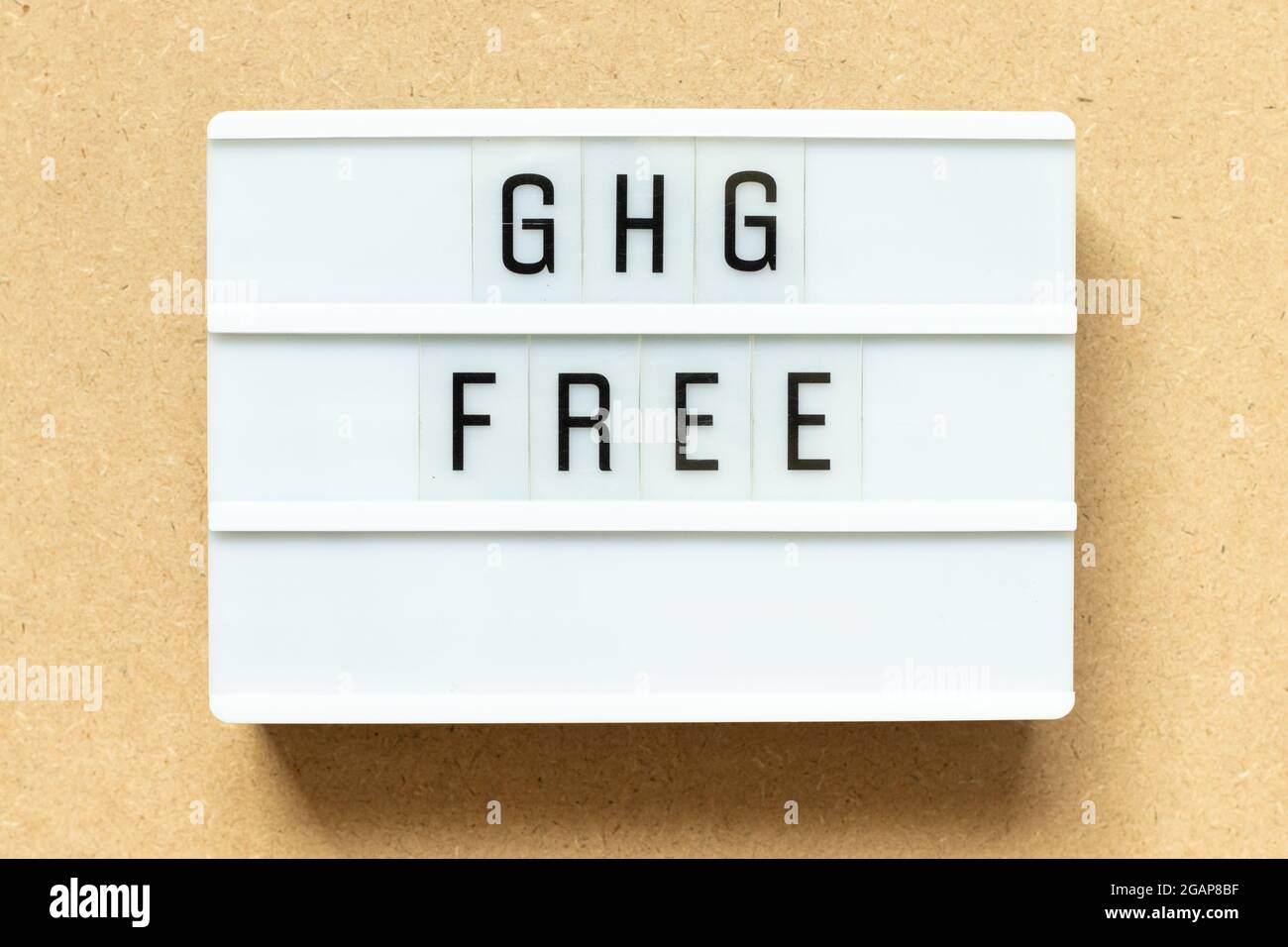Lightbox with word GHG (Abbreviation of greenhouse gas) free on wood background Stock Photo
