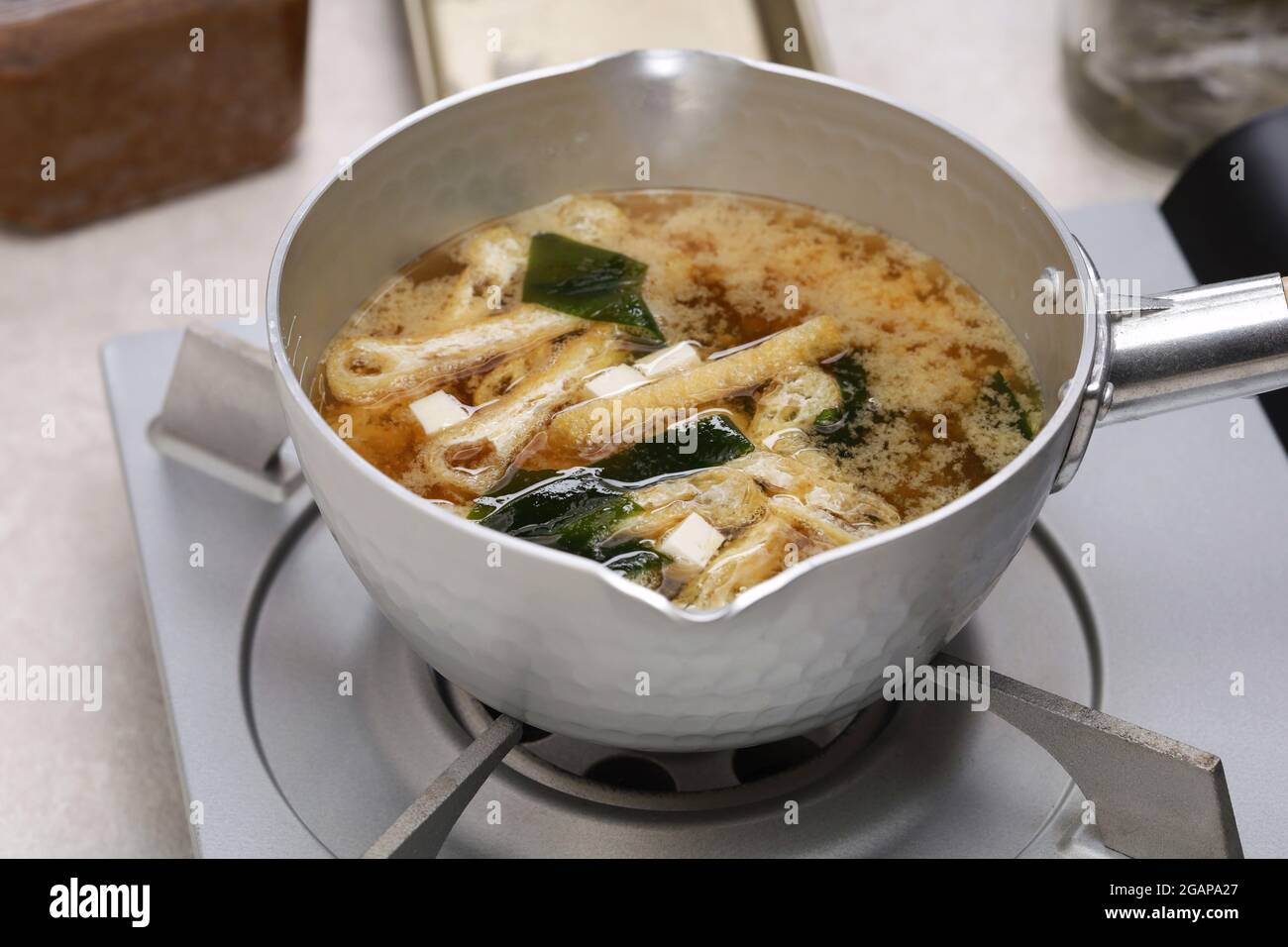 How to make Japanese miso soup.   Combine with ingredients. Do not bring to a boil. Stock Photo