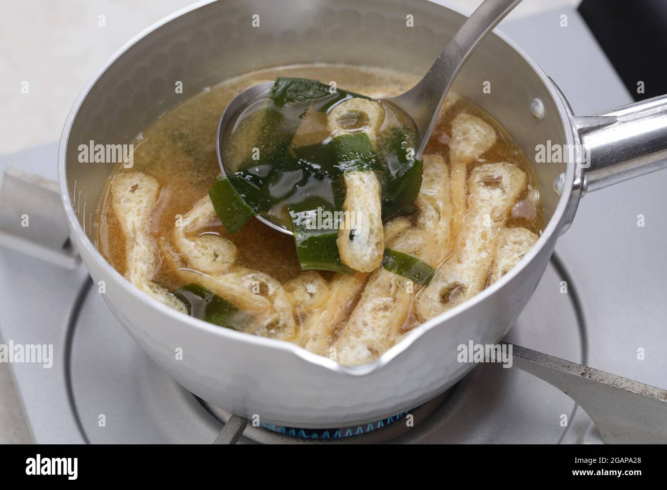 How to make Japanese miso soup.  Let’s use a ladle for miso soup. Stock Photo