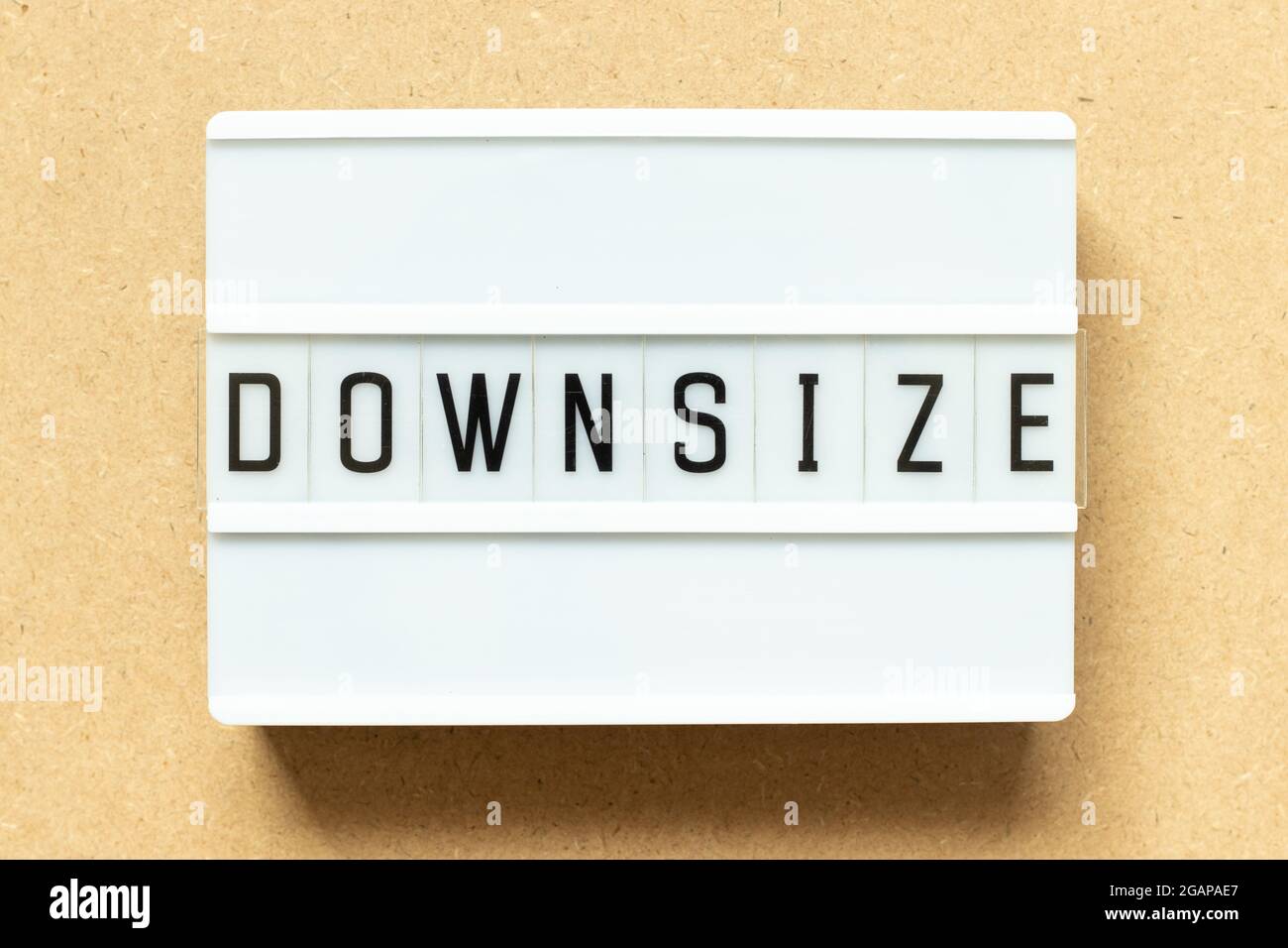 Lightbox with word downsize on wood background Stock Photo