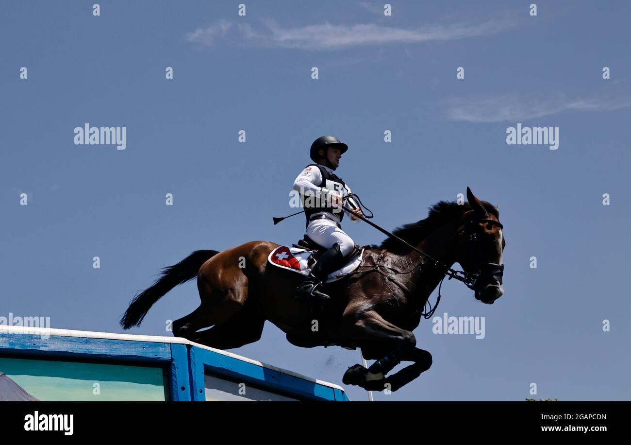 Tokyo 2020 Olympics - Equestrian - Eventing - Cross Country Team - Final - Sea Forest XC Course - Tokyo, Japan - August 1, 2021. Robin Godel of Switzerland on his horse Jet Set compete REUTERS/Alkis Konstantinidis Stock Photo