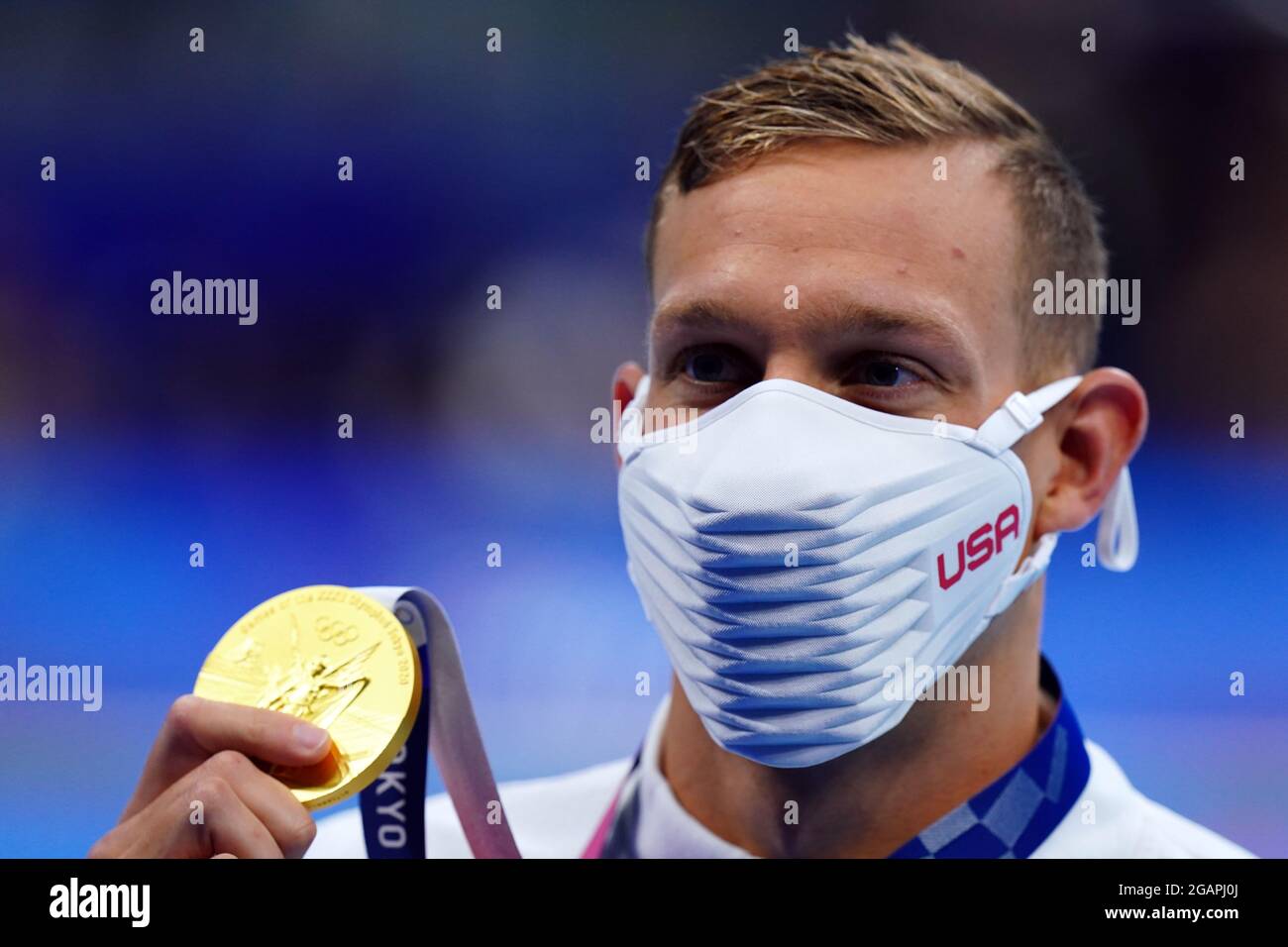 USA's Caeleb Dressel celebrates with his gold medal following the Men's