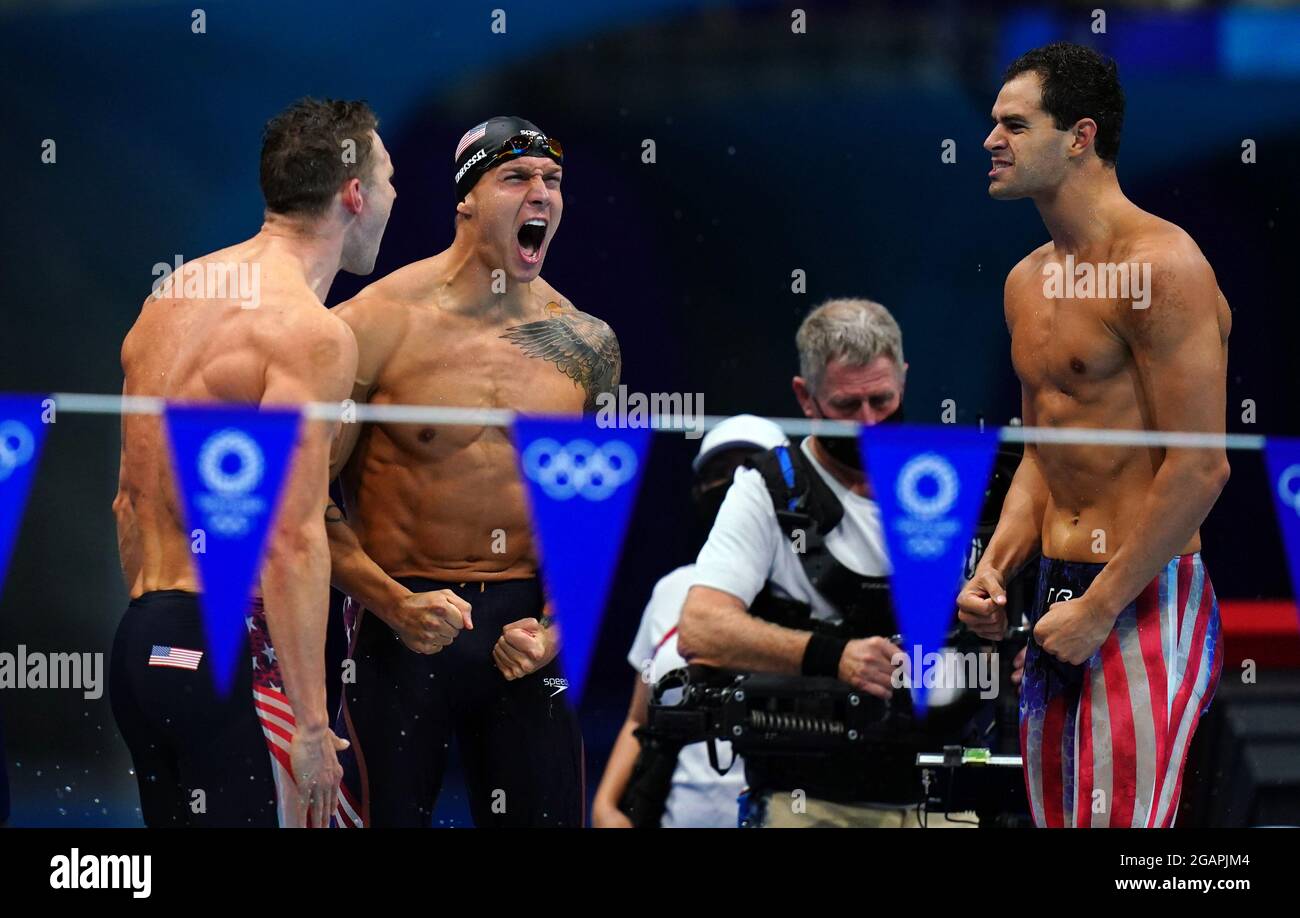 The USA team including Caeleb Dressel (centre) celebrate winning gold ...