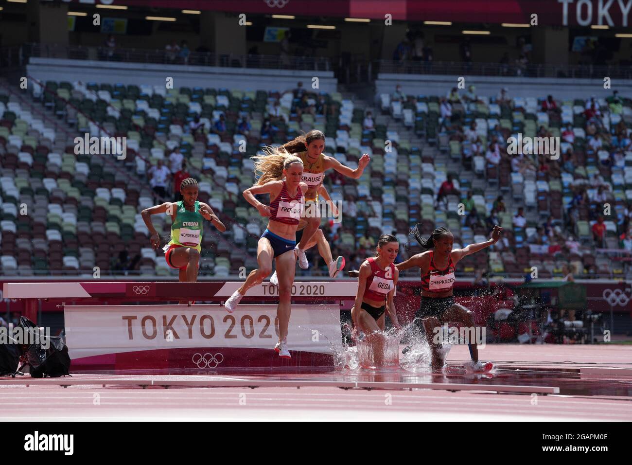 1st August 2021; Olympic Stadium, Tokyo, Japan: Tokyo 2020 Olympic summer games day 9; Womens 3000m steeplechase heats: GEGA Luiza of Albania and eventual winner FRERICHS Courtney of USA take the water jump Stock Photo