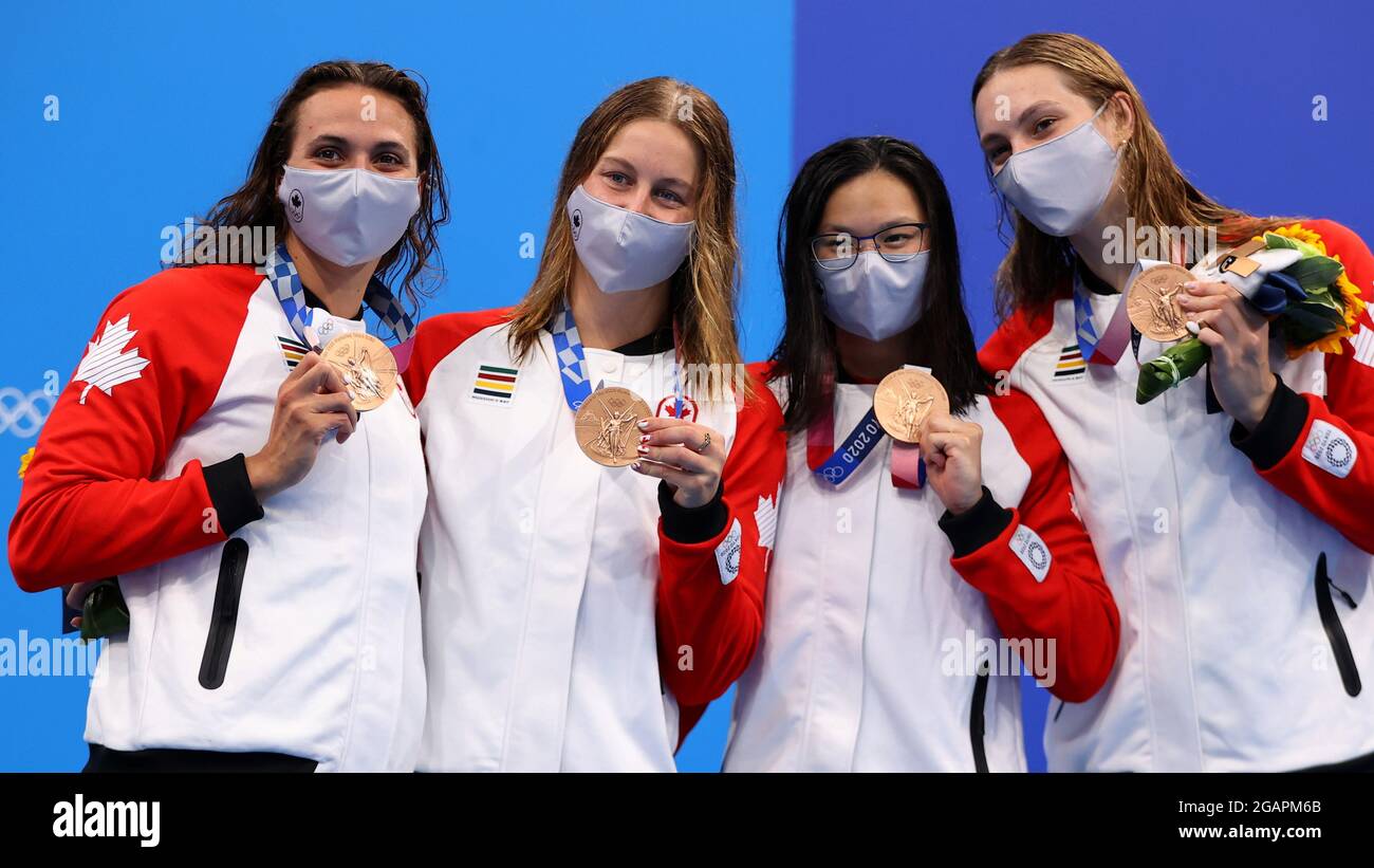 Tokyo 2020 Olympics - Swimming - Women's 4 x 100m Medley Relay - Medal Ceremony - Tokyo Aquatics Centre - Tokyo, Japan - August 1, 2021. Kylie Masse of Canada, Sydney Pickrem of Canada, Maggie MacNeil of Canada and Penny Oleksiak of Canada with their bronze medals REUTERS/Marko Djurica Stock Photo