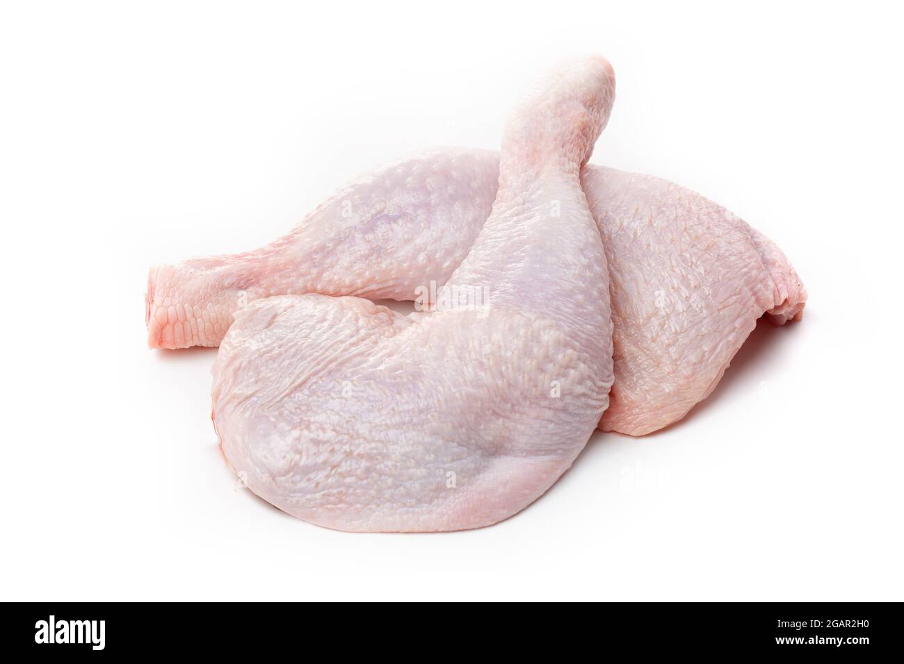 Raw chicken thighs with skin on a white background Stock Photo - Alamy