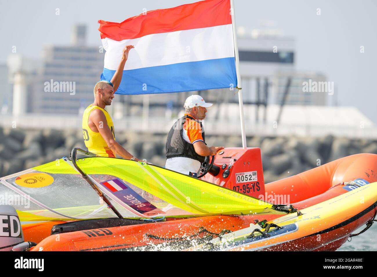 TOKYO, JAPAN - JULY 31: Kiran Badloe of the Netherlands celebrating his golden medal win competing on Men's Windsufer - RS:X during the Tokyo 2020 Olympic Games at the Sagami on July 31, 2021 in Tokyo, Japan (Photo by Ronald Hoogendoorn/Orange Pictures) NOCNSF Stock Photo
