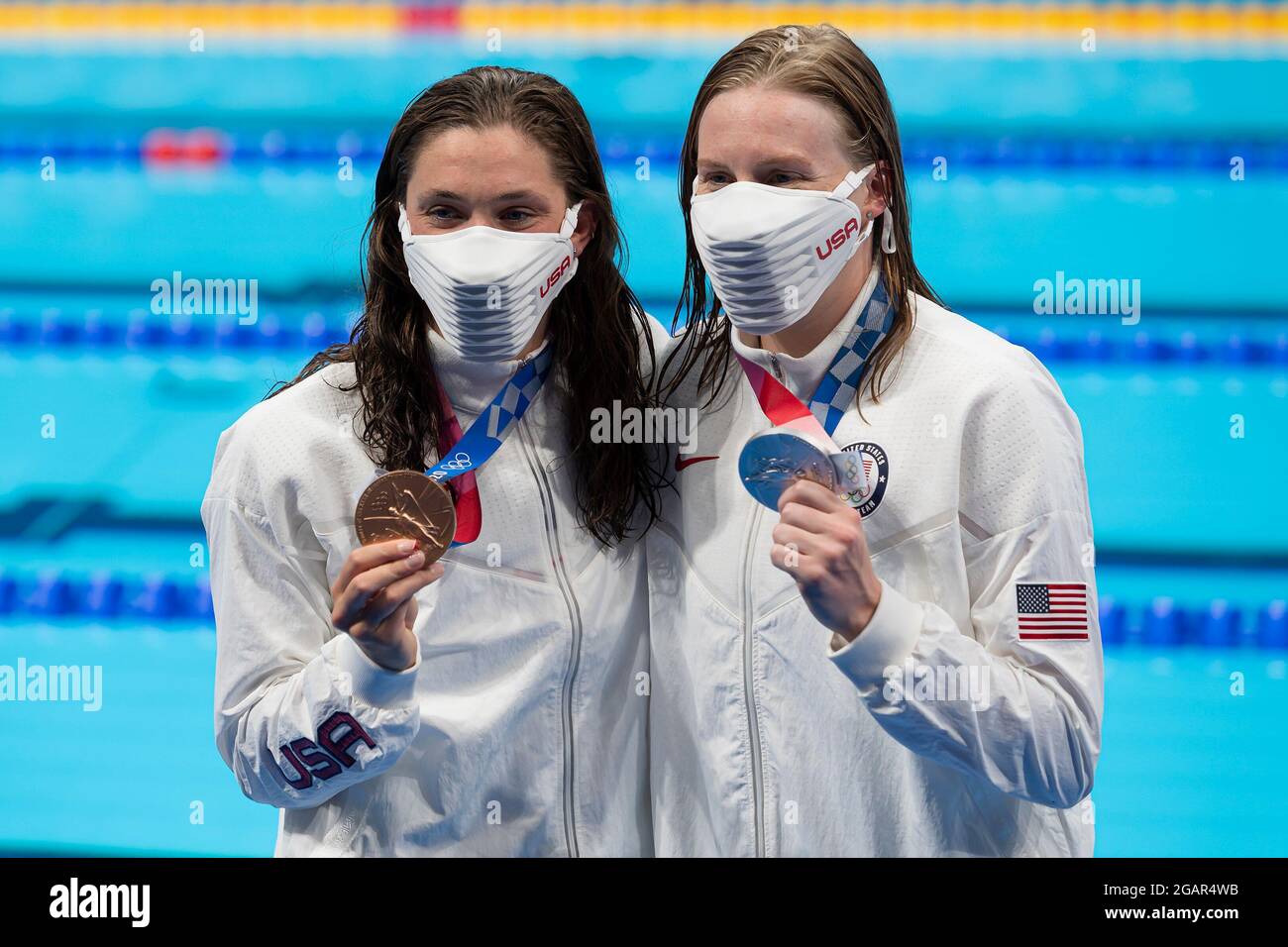 TOKYO, JAPAN - JULY 30: Lilly King of United States, silver and Annie Lazor of United States, bronze, show the medals after competing in the women 200 Stock Photo