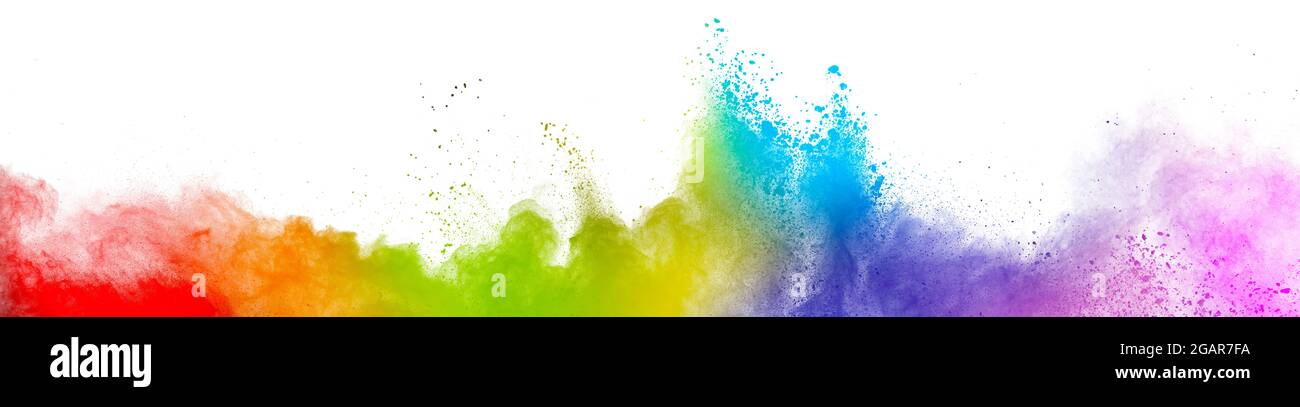 Colorful rainbow holi paint. Vivid color powder explosion isolated on white wide panorama background. Stock Photo