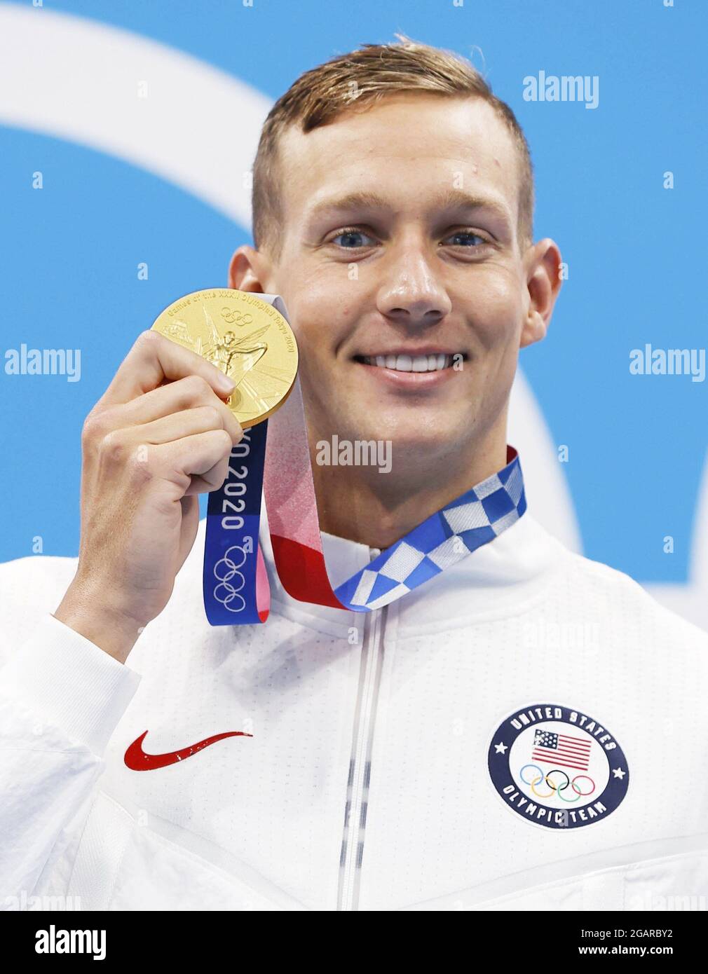 Caeleb Dressel of the United States poses with his gold medal in the