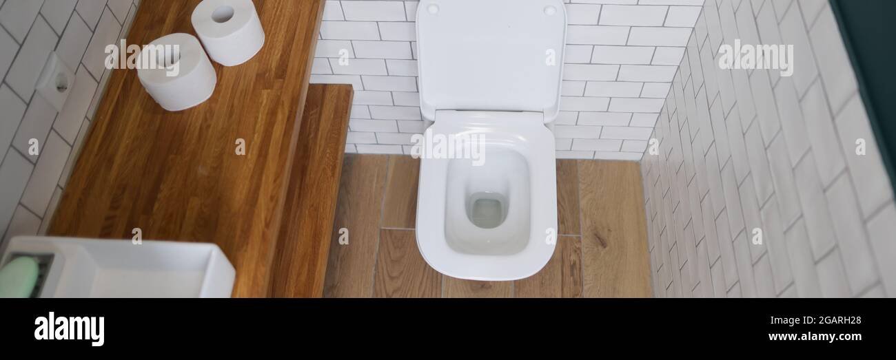 Toilet bowl stall in modern bathroom interior closeup Stock Photo - Alamy