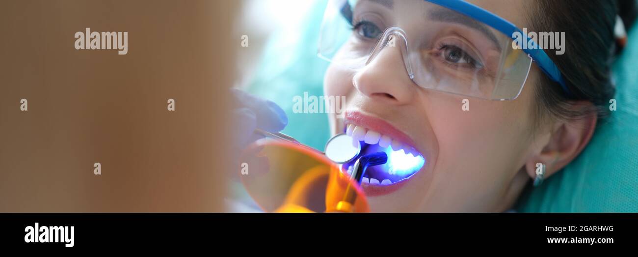 Patient visiting dentist for regular checkup and filling teeth closeup