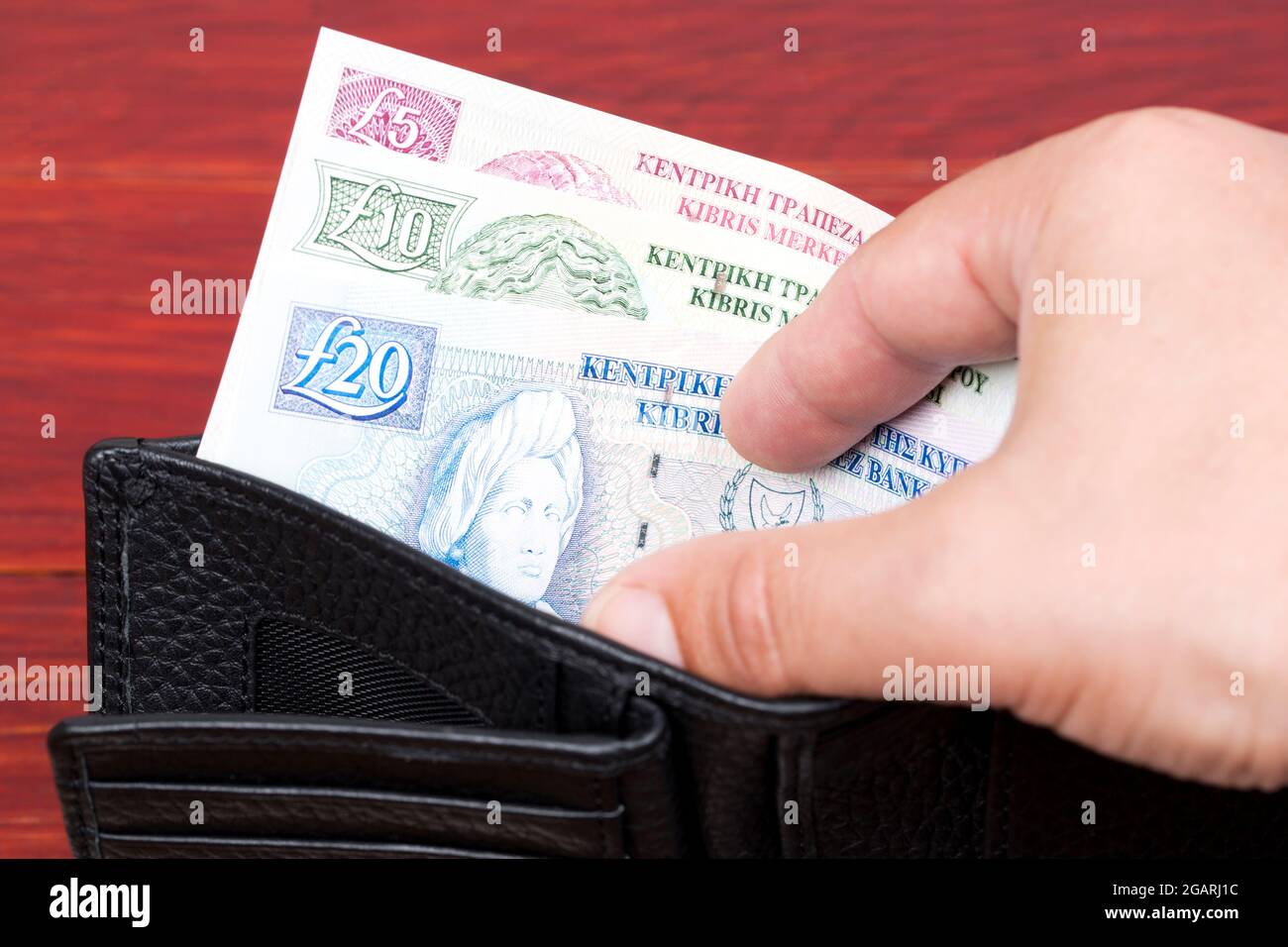 Old Cypriot money - pound in the black wallet Stock Photo