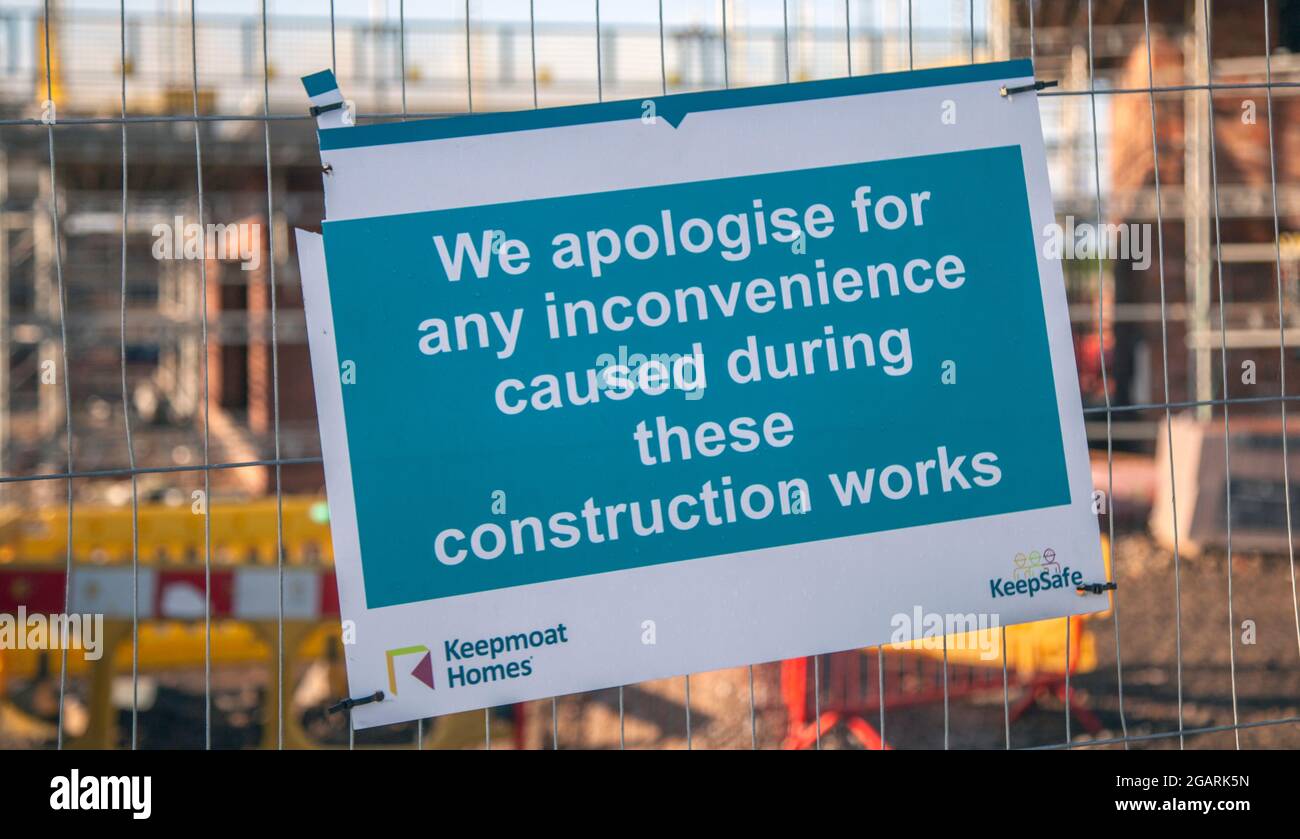 'Construction Works Inconvenience' KeepMoat Homes new housing development construction site. PPE Health & Safety Regulations for employees working on building site. Stock Photo