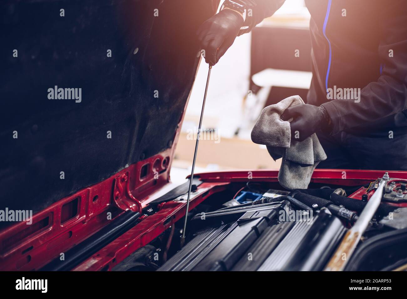 Man repairing car engine with his tools Stock Photo - Alamy