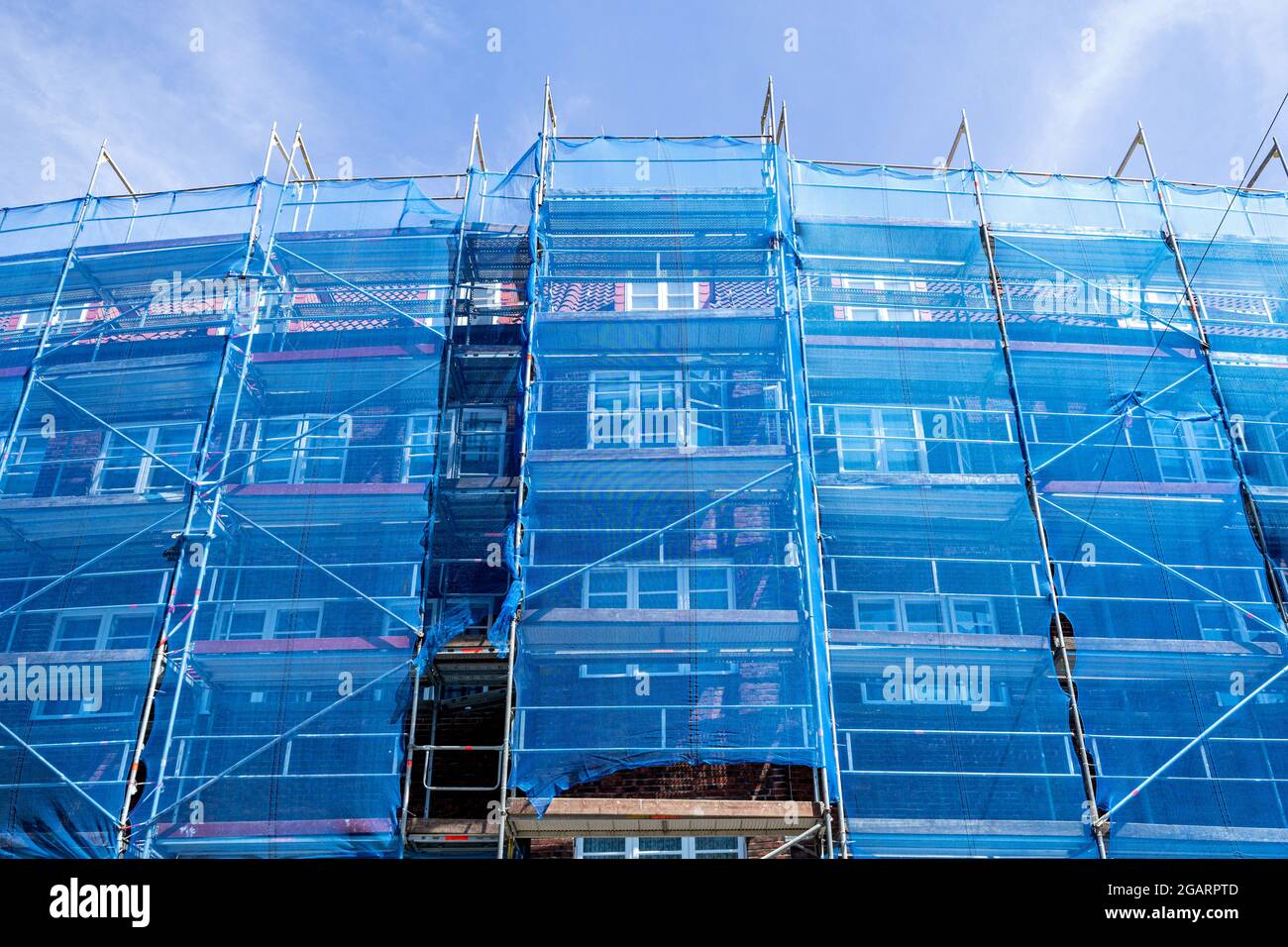 scaffolding at a residential building currently under renovation Stock Photo