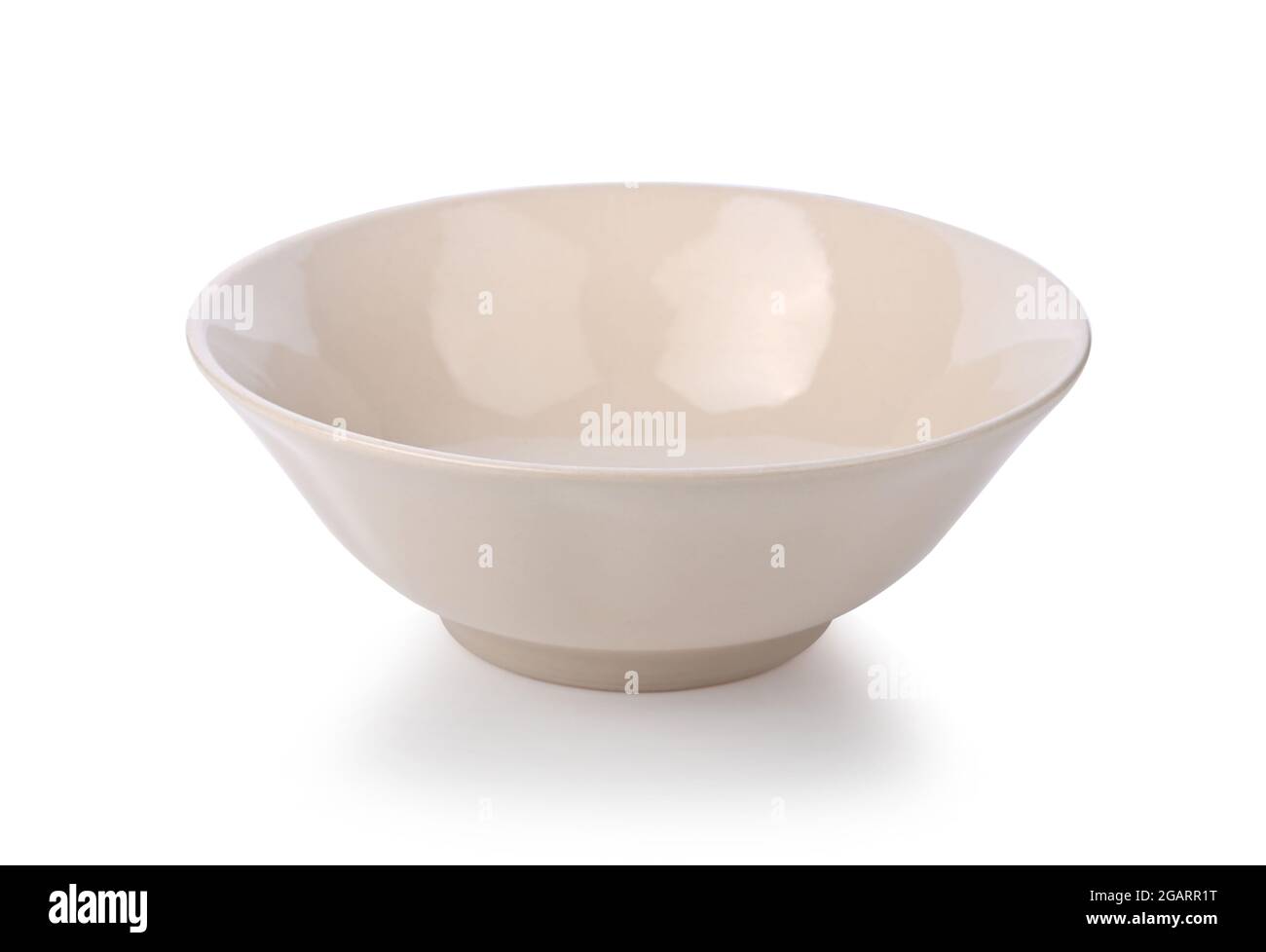 Beige or ramekin ceramic bowl on a white background Stock Photo