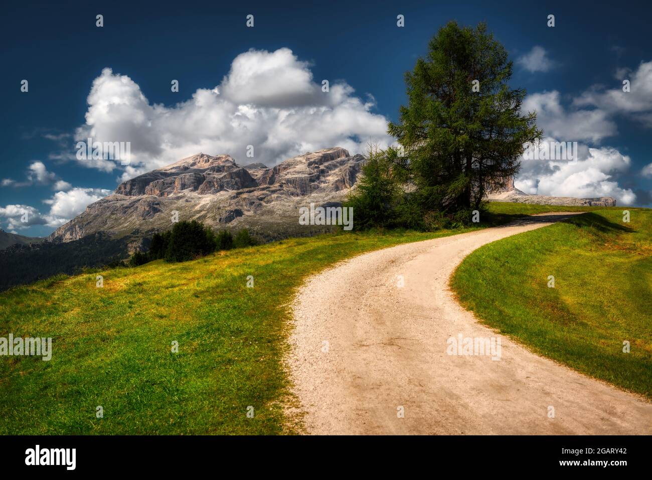 mountain path with great panorama on the Group of Sella in Alta Badia, South Tyrol Stock Photo