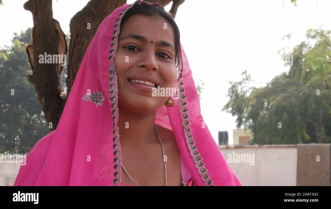 An Indian woman in traditional Indian clothes smili Stock Photo - Alamy
