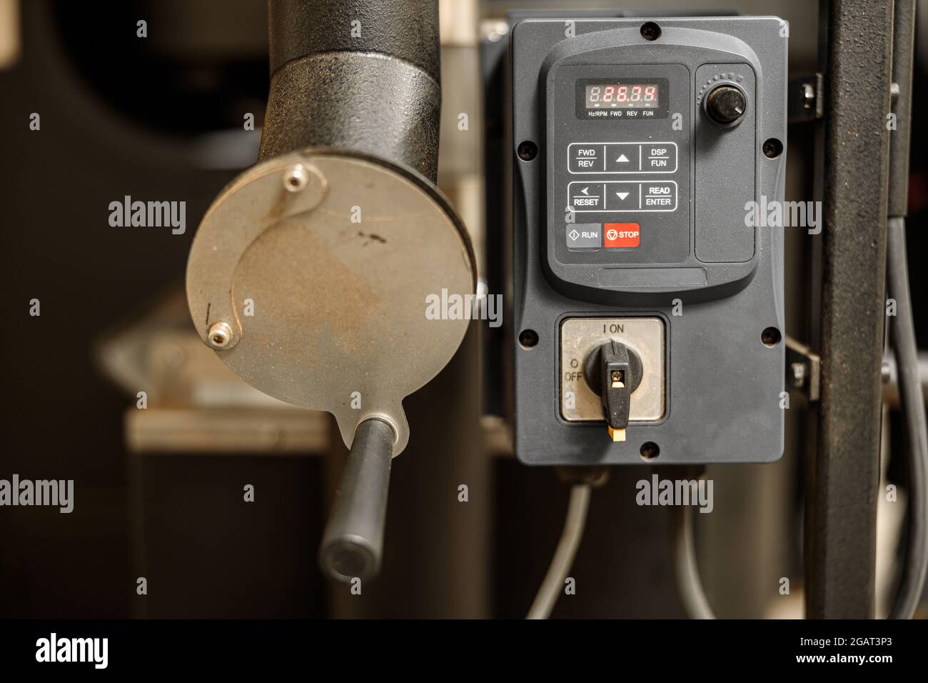 Coffee processing. Roastery, roasting machine and fresh beans Stock ...