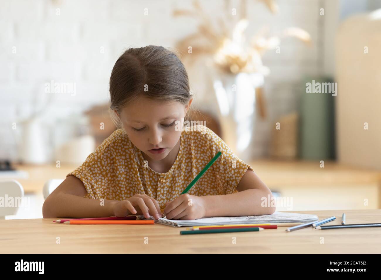 Close up little girl drawing with colorful pencils at home Stock Photo ...