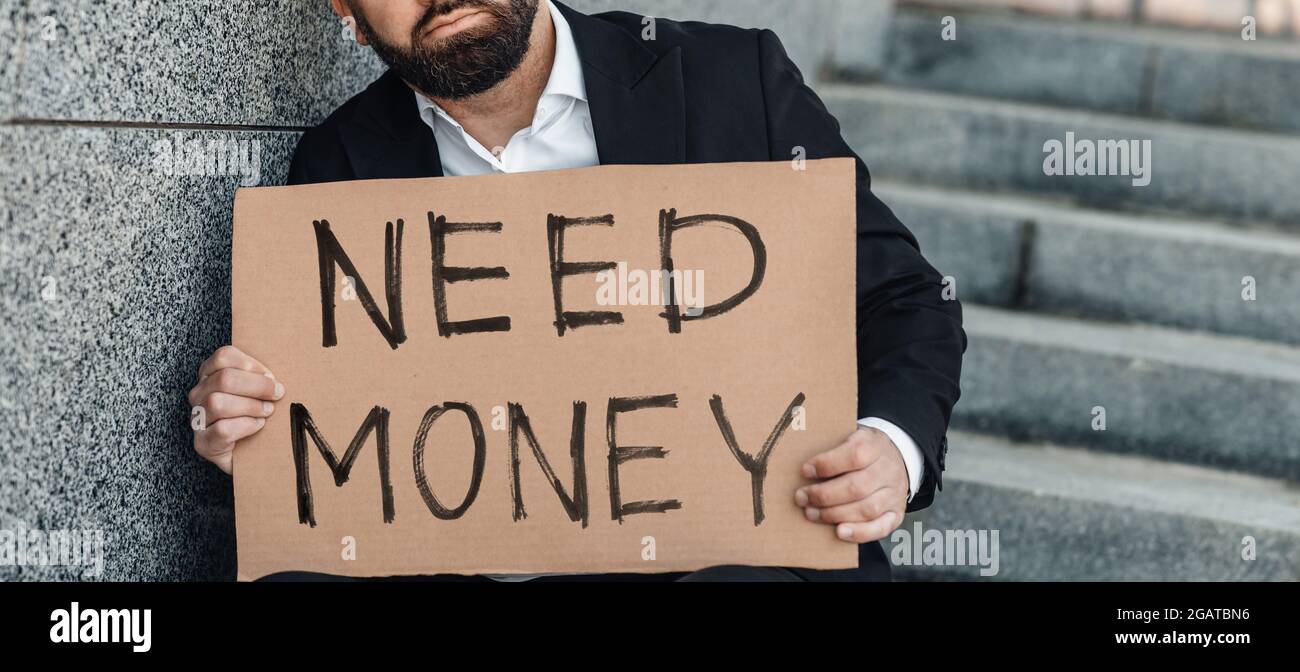 Unrecognizable mature businessman holding poster cardboard  display picture 1