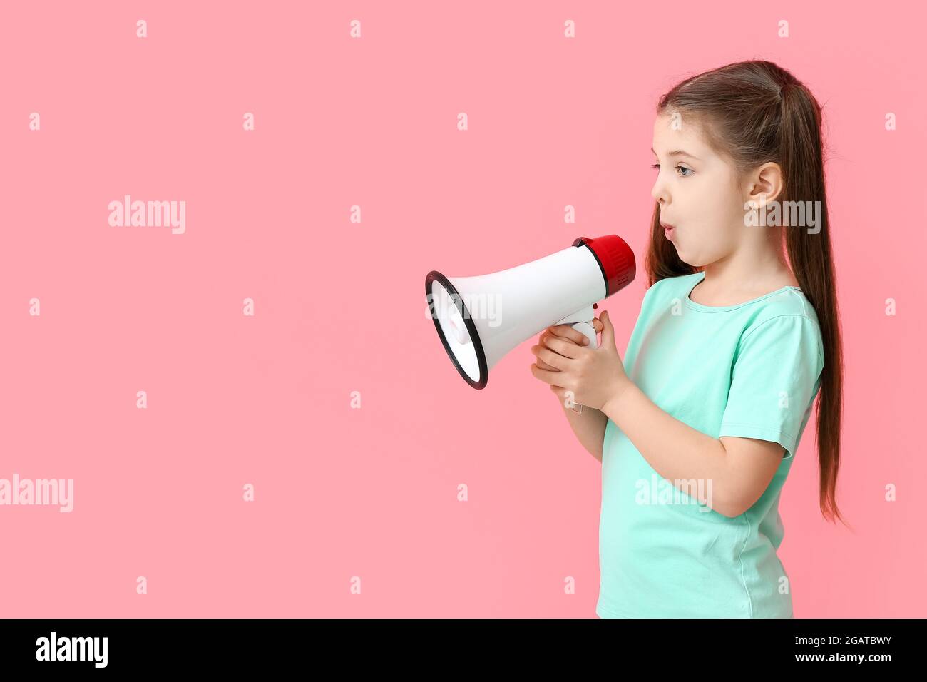 Little girl with megaphone training pronounce letters on color background  Stock Photo - Alamy