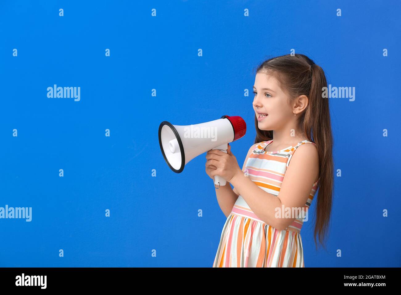 Little girl with megaphone training pronounce letters on color background  Stock Photo - Alamy