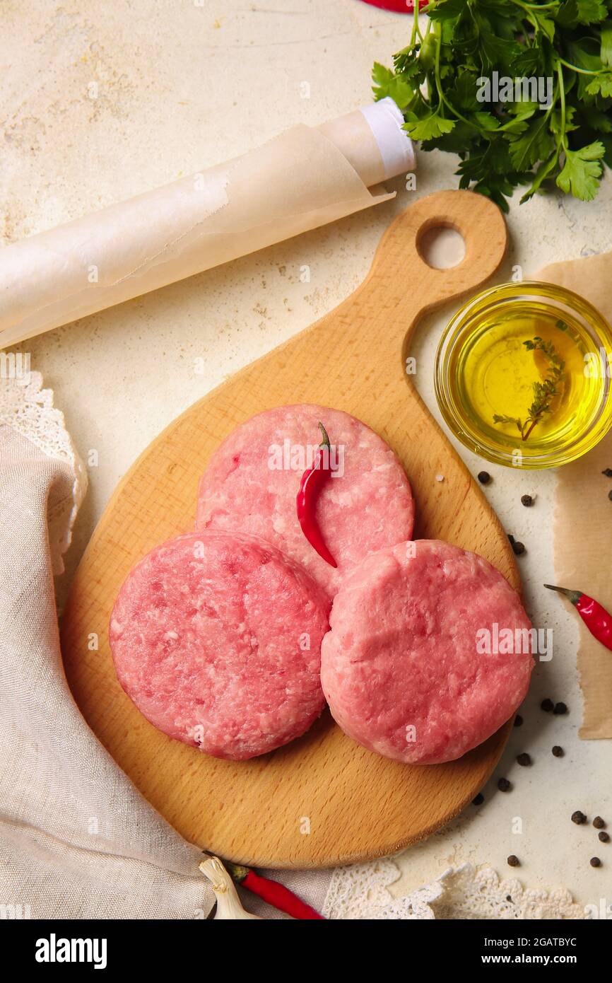 Composition with raw cutlets made of fresh forcemeat on light