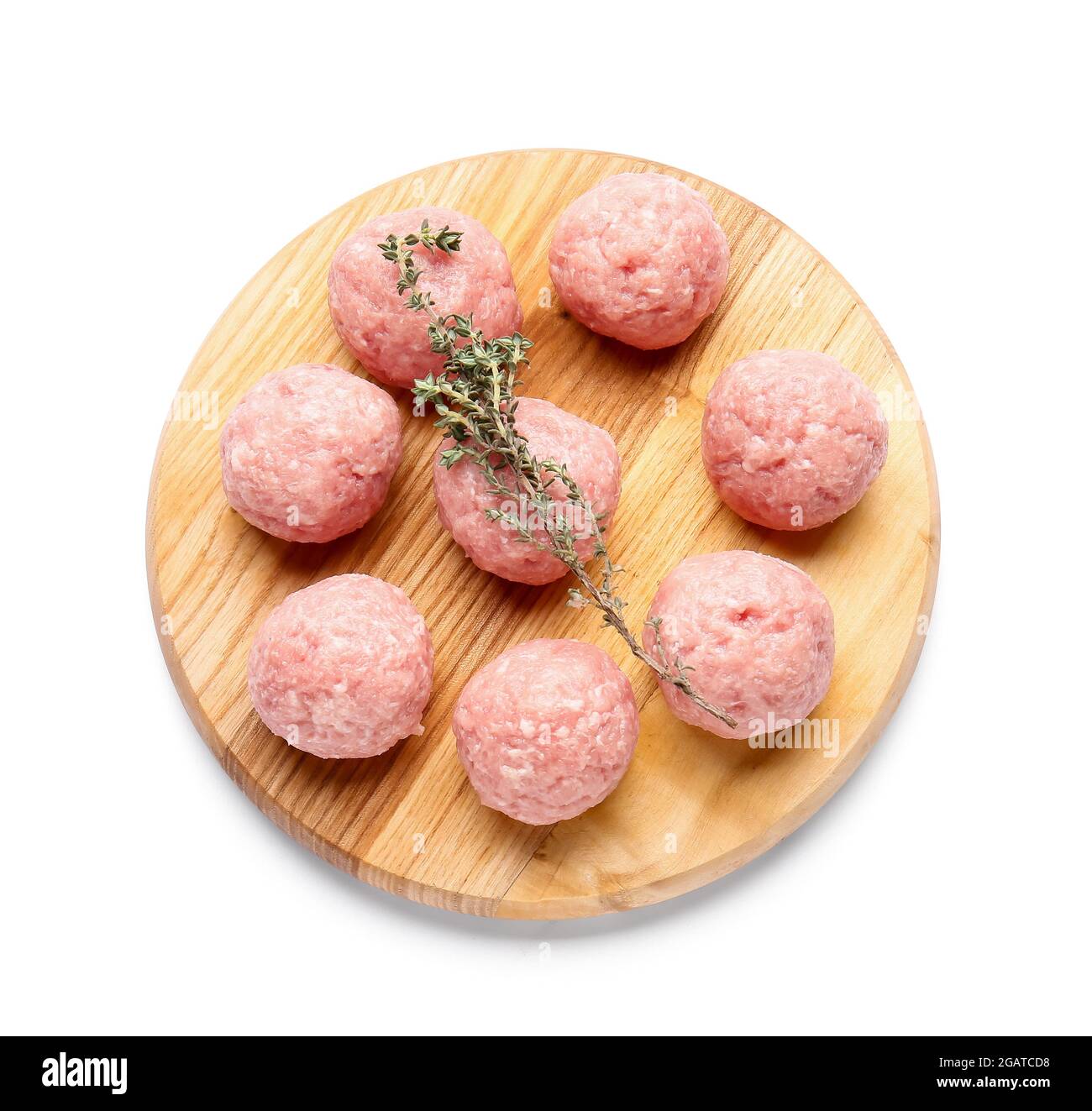 Wooden board with raw cutlets made of fresh forcemeat on white ...