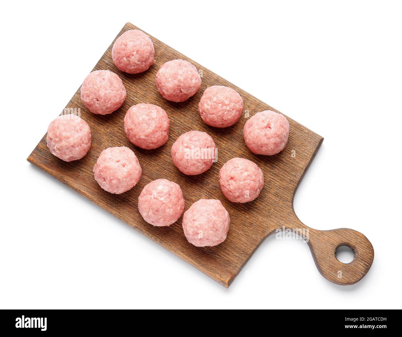 Wooden board with raw cutlets made of fresh forcemeat on white