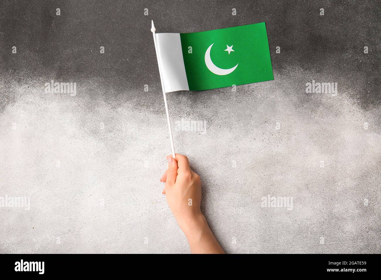 Female hand with Pakistan flag on black and white background Stock ...