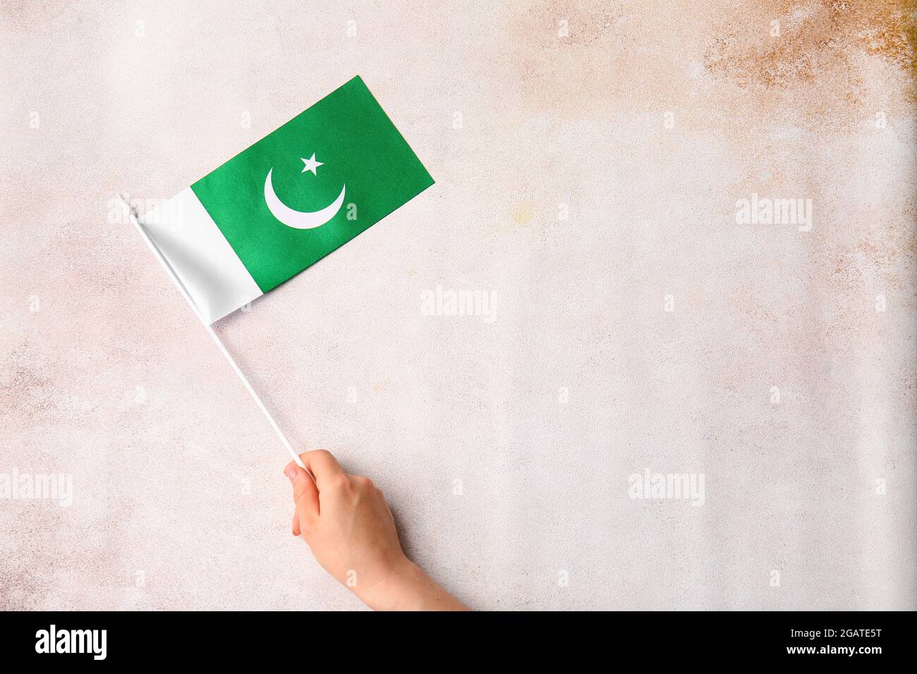 Female hand with Pakistan flag on grunge background Stock Photo - Alamy