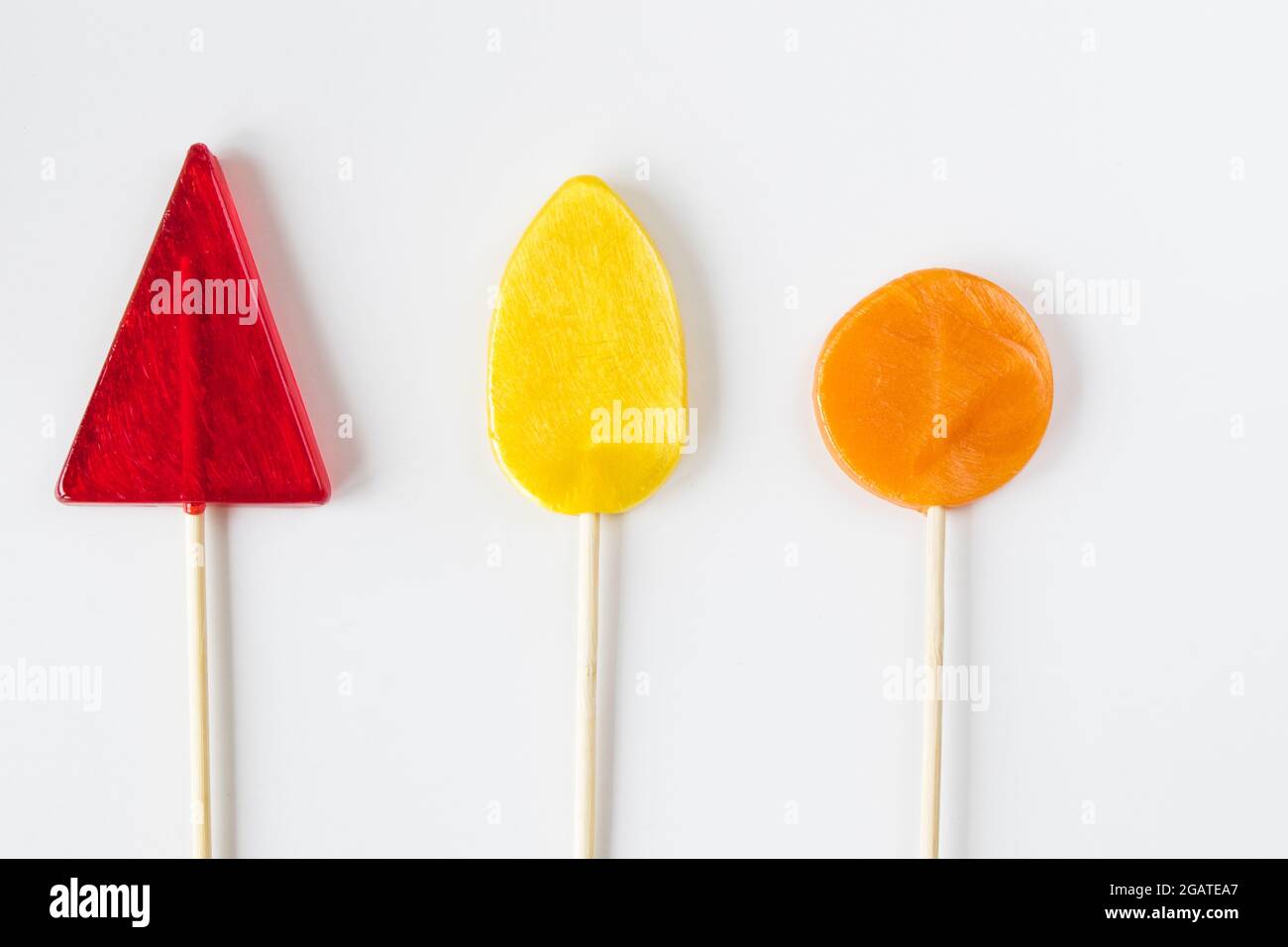 A top view of colorful sweet candies isolated on a white background ...