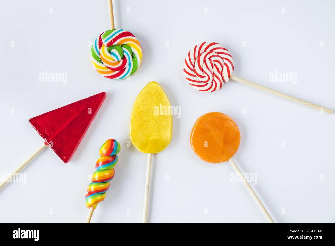 A top view of colorful sweet candies isolated on a white background ...
