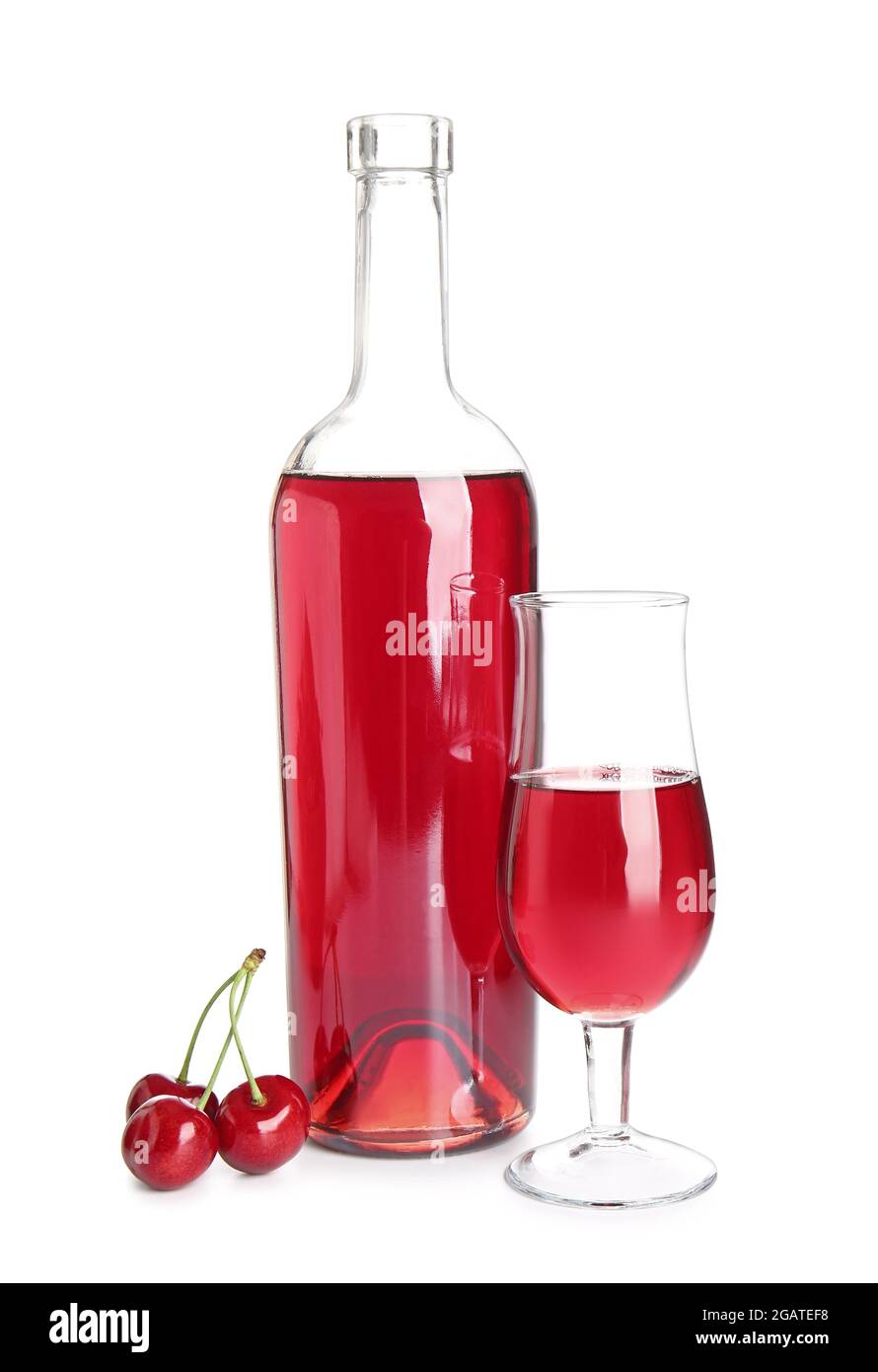 Bottle and glass of sweet cherry wine on white background Stock Photo Alamy