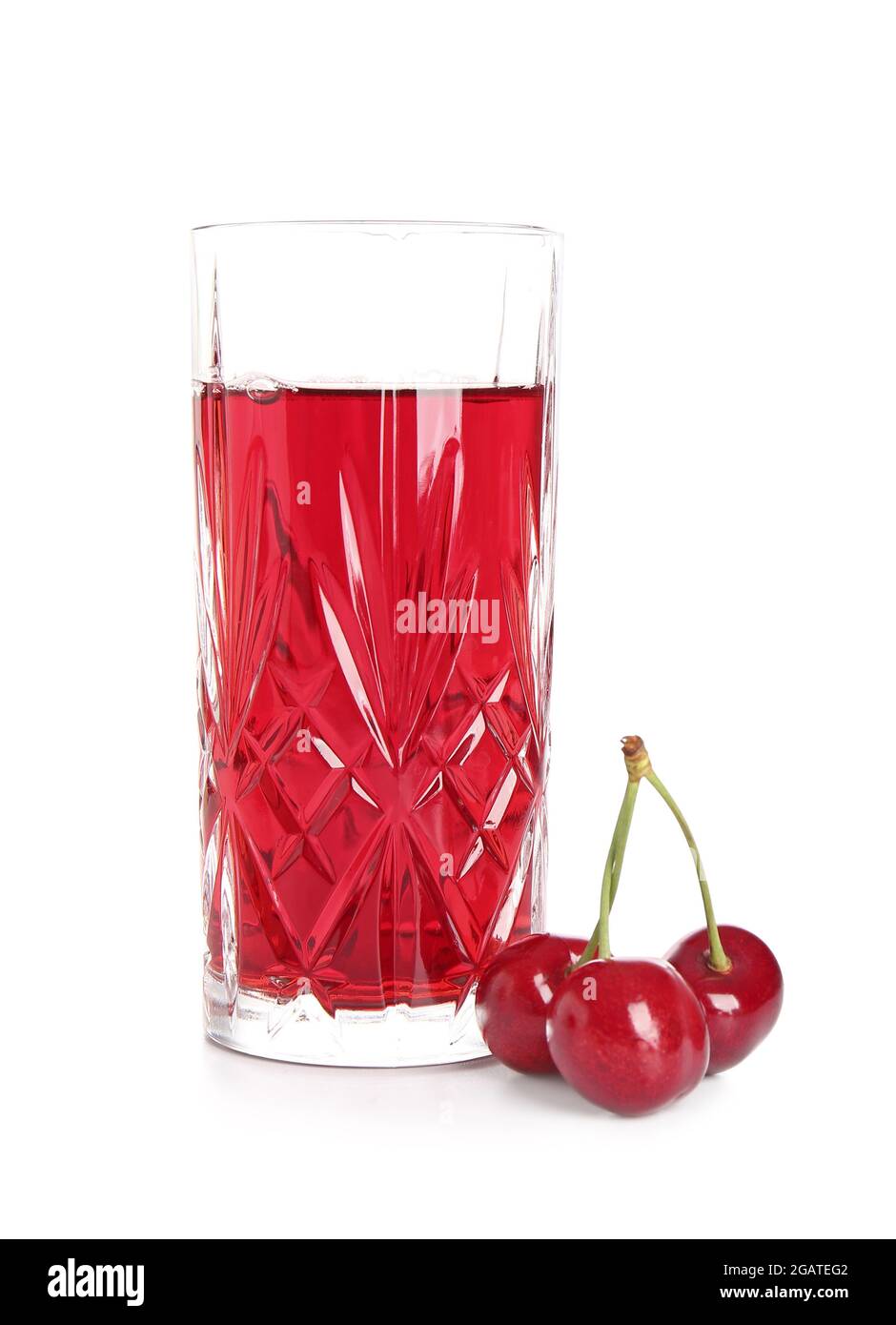 Glass of sweet cherry wine on white background Stock Photo - Alamy