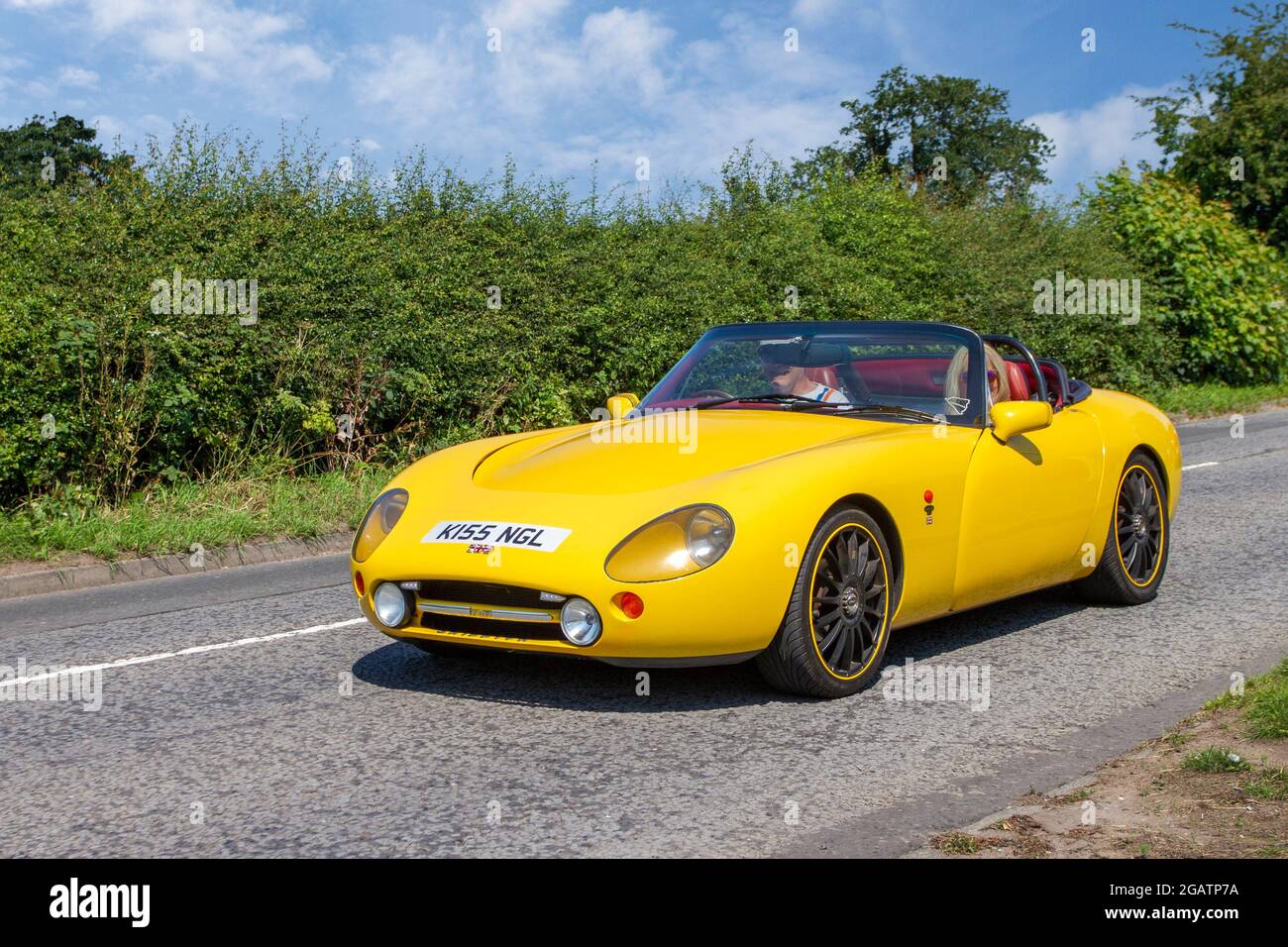 1998 90s yellow British TVR Griffith Base 4997cc cabrio en-route to Capesthorne Hall classic July car show, Cheshire, UK Stock Photo