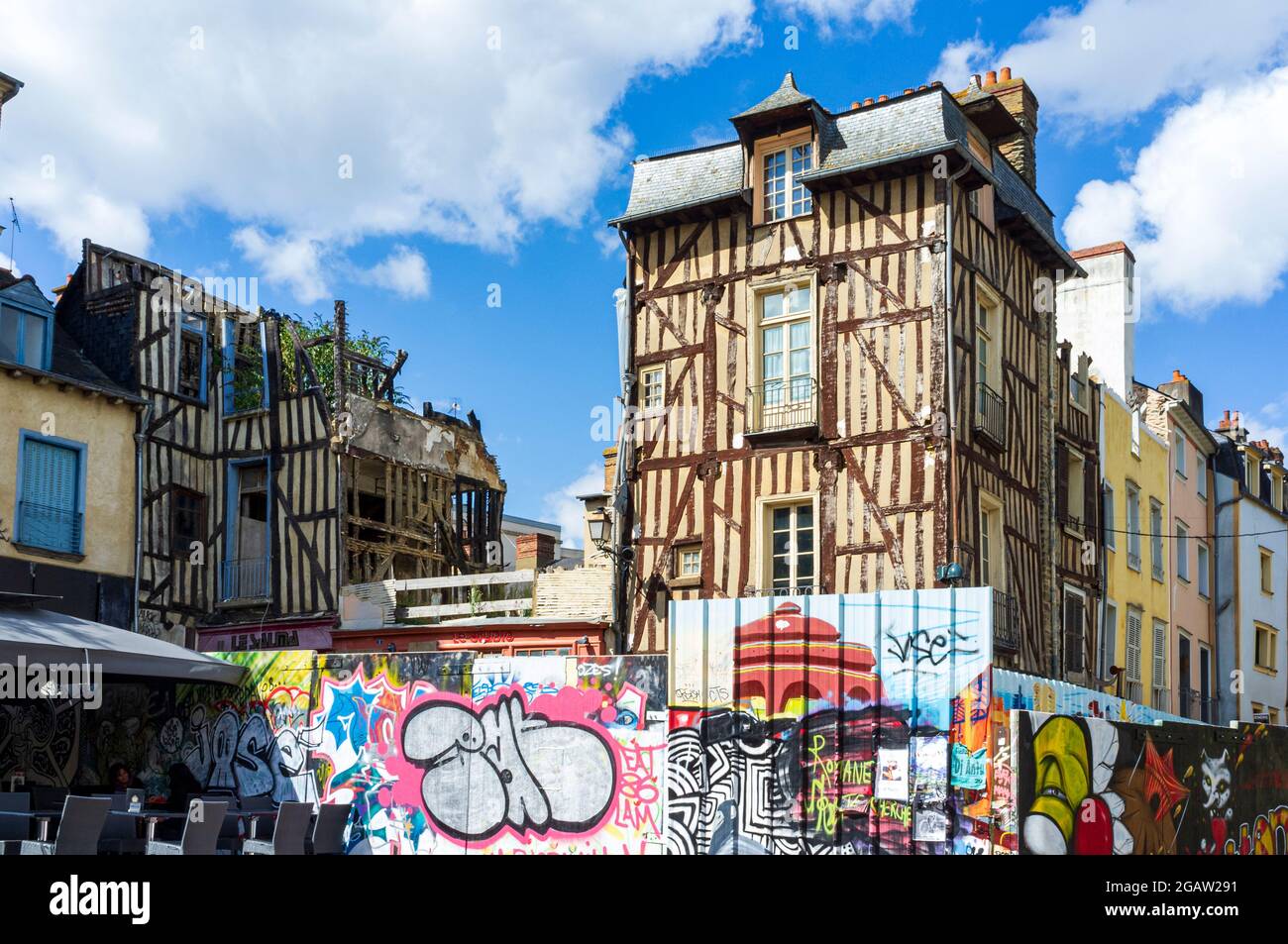 Colourful graffiti and timbered buildings in Rennes, Brittany, France Stock Photo