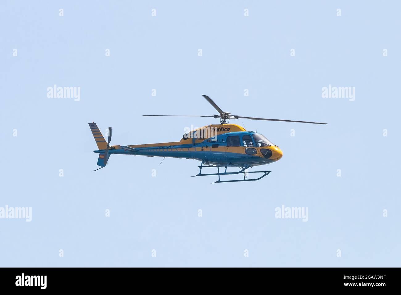 Huelva, Spain - July 30, 2021: Helicopter of the Guardia Civil de Trafico (Civil Traffic Guard) patrolling the roads and highways to control reckless Stock Photo