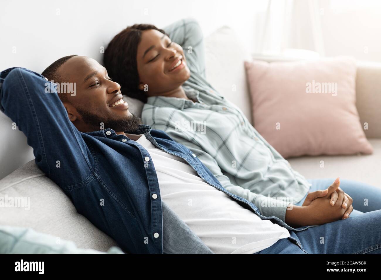 African Man Sleeping On Sofa High Resolution Stock Photography and ...