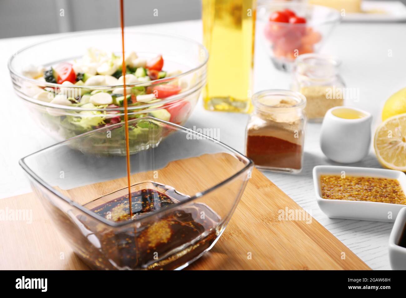 Process of preparing sauce for salad, at kitchen Stock Photo Alamy