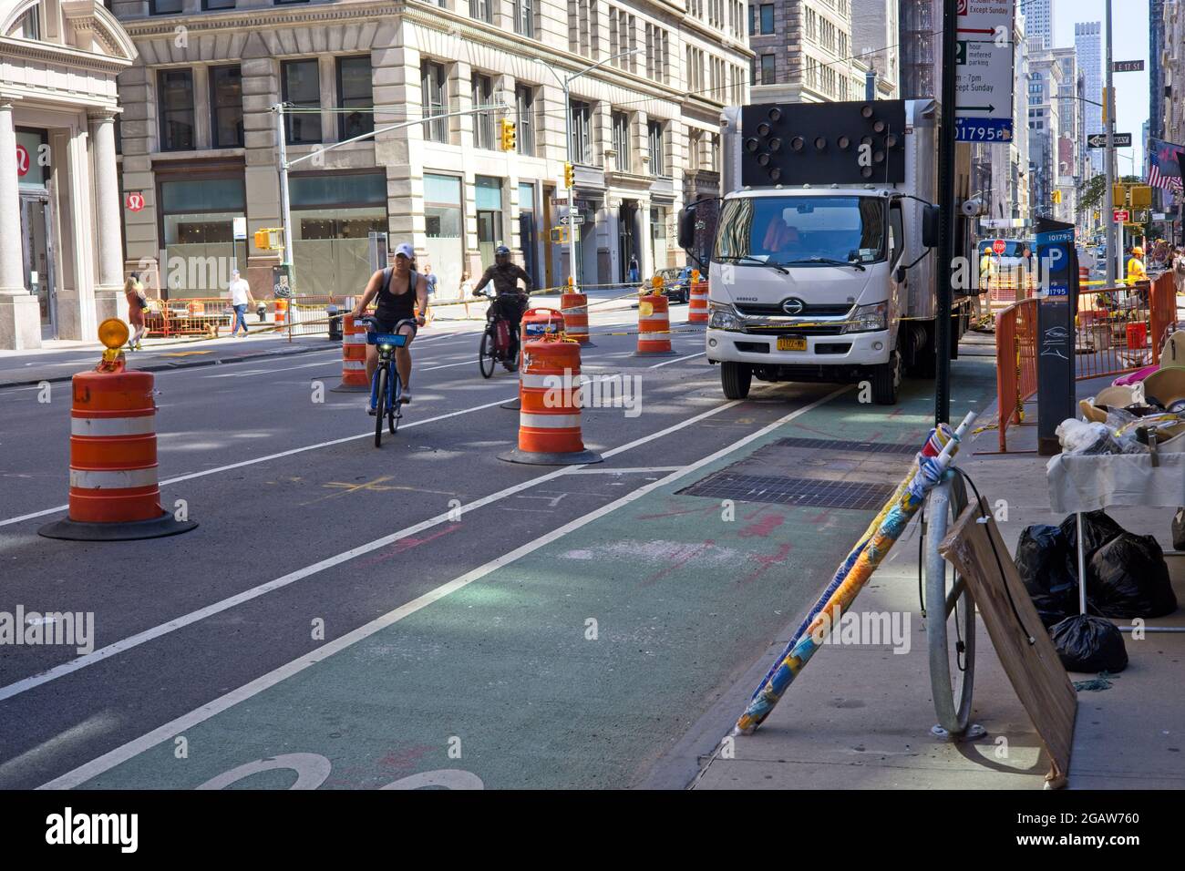 New York, NY, USA - Aug 1, 2021: Special lane on 5th Ave for bicyclists because regular bike lane is blocked by construction Stock Photo