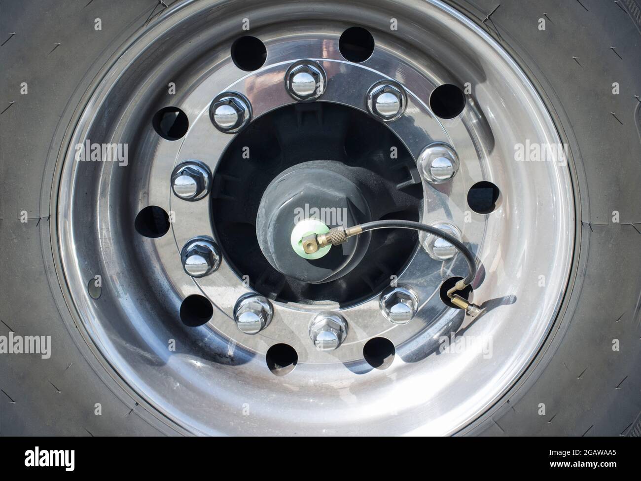 Truck wheel equipped with tire inflation system. Closeup Stock Photo