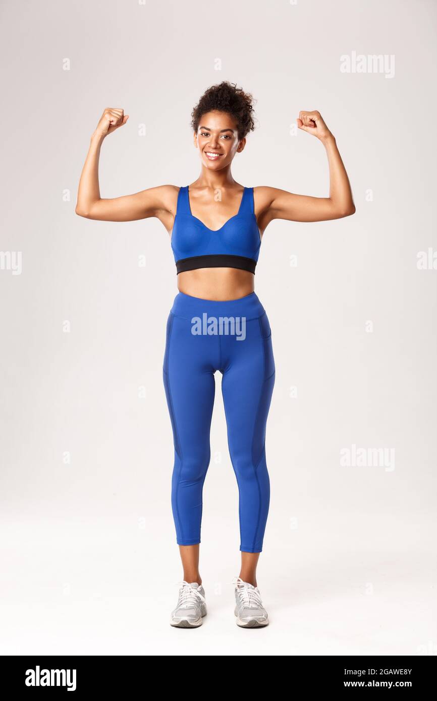Powerful confident woman flexing muscles hi-res stock photography and  images - Alamy