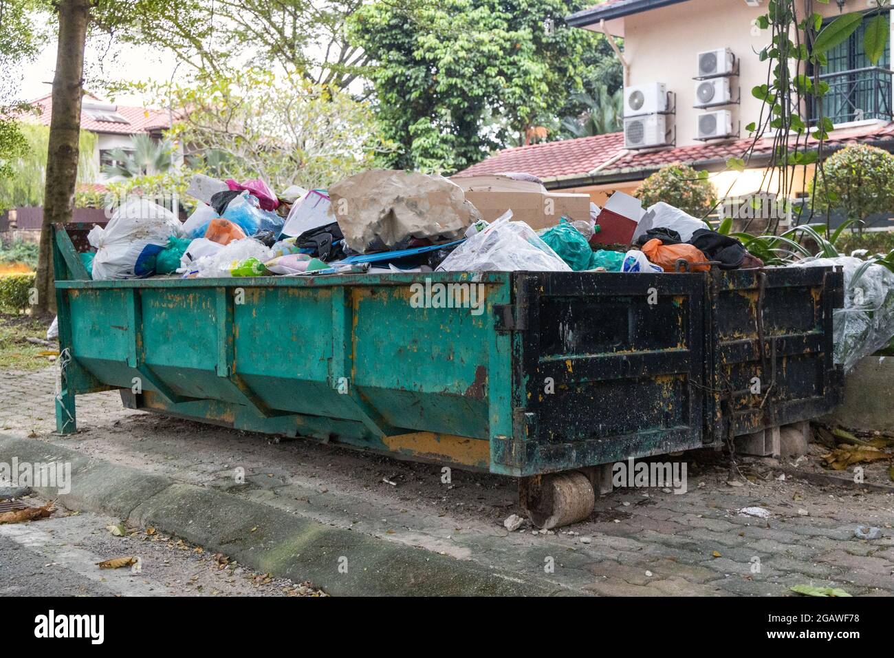 Rubbish dumspter or roro bin with load of waste from construction