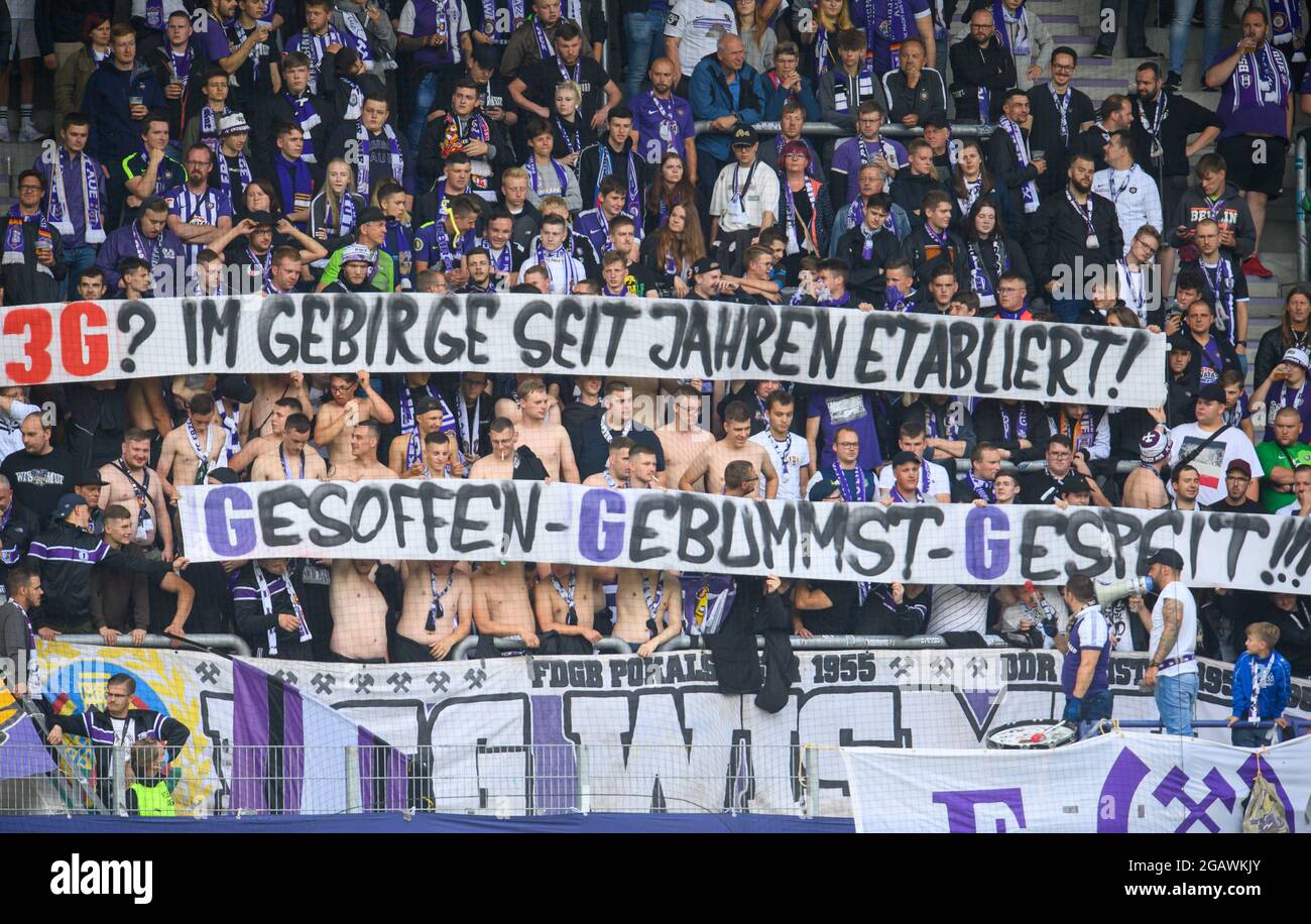 Aue, Germany. 01st Aug, 2021. Football: 2. Bundesliga, FC Erzgebirge Aue -  FC St. Pauli, Matchday 2, at Erzgebirgsstadion. Aue's fans with a banner  saying "3G? Established in the mountains for years!