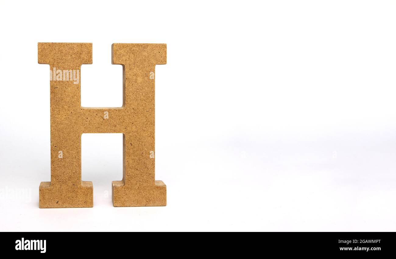Letter H made of MDF on a white background Stock Photo